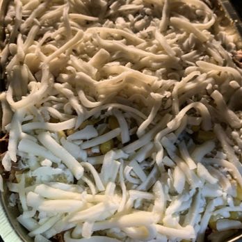 La Cocina de Ana - a pizza covered in cheese - Mexican Near Me - Saint Paul, Minnesota