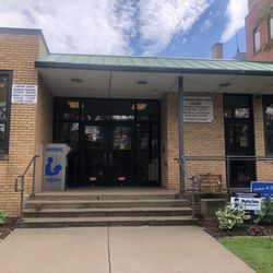 Bacon Memorial District Library - Ramp side entrance with cornerstone of the original Andrew Carnegie Library of Wyandotte, Michigan