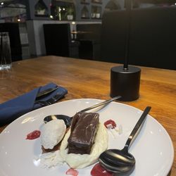 Asaderos Mexican Grill - Flourless chocolate cake with ice cream, whipped cream, coconut, raspberry sauce.