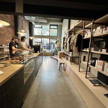 Saint Cecilia - barista behind the counter, vigorously whisking the matcha - Coffee & Tea Near Me - Victoria, British Columbia
