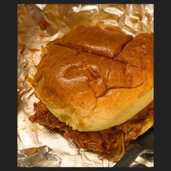 Adam's Taphouse Grille - slow roasted pulled pork on brioche roll. Your choice of sauce North Carolina, traditional red sauce or Pig Pickin