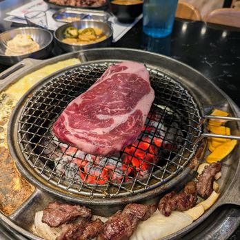 Cow Wow Korean BBQ - Ribeye Steak on the grill. Delicious. - Korean Near Me - Suwanee, Georgia Cow Wow Korean BBQ - Ribeye Steak on the grill. Delicious. - Korean Near Me - Suwanee, Georgia