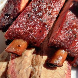 a close up of ribs and carrots