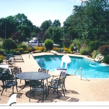 Molloy Landscaping - a pool and patio area - Landscaping Near Me - Farmingdale, New York Molloy Landscaping - a pool and patio area - Landscaping Near Me - Farmingdale, New York