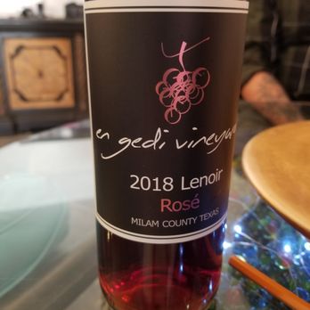 En Gedi Vineyards - a bottle of wine on a table - Wineries Near Me - Calvert, Texas