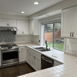 a woman standing in a kitchen