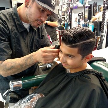 Raymond's Barber Shop - My son getting his haircut at Raymond's with Cesar - Barbers Near Me - Santee, California Raymond's Barber Shop - My son getting his haircut at Raymond's with Cesar - Barbers Near Me - Santee, California