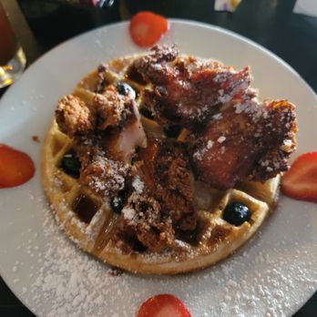 The Trestle - Closer look of the Chicken & Waffles now covered in syrup. - Cocktail Bars Near Me - Astoria, New York