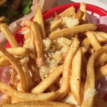 Sweet Pea's Cafe & Catering - Garlic Parmesan fries - little blocks of cheese weren't melted and were awkward with the fries - Creperies Near Me - Capitola, California