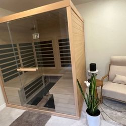 Bathroom remodel including a home sauna and relaxation area.