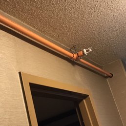 Odd red gadget hanging from this pipe in the room. Otherwise, room is clean and comfy.