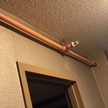 Holiday Inn Pittsburgh-Monroeville - Odd red gadget hanging from this pipe in the room. Otherwise, room is clean and comfy. - Venues & Event Spaces Near Me - Monroeville, Pennsylvania