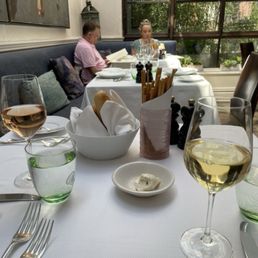Table with wine, bread, bread sticks and an utterly fantastic tasting truffle butter Table with wine, bread, bread sticks and an utterly fantastic tasting truffle butter