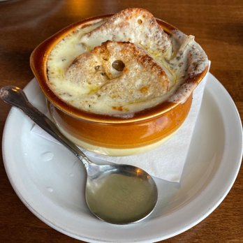 Branding Iron - a bowl of soup on a plate with a spoon - Bars Near Me - Bridgeview, Illinois Branding Iron - a bowl of soup on a plate with a spoon - Bars Near Me - Bridgeview, Illinois