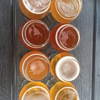 Alley Brews - Flight - French Saison, Creamsicle IPA, Strawberry Saison, & Orange Milkshake IPA - Brewpubs Near Me - Denver, Colorado Alley Brews - Flight - French Saison, Creamsicle IPA, Strawberry Saison, & Orange Milkshake IPA - Brewpubs Near Me - Denver, Colorado