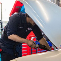 Quality Tune-Up - Servicing Customer's Vehicle.