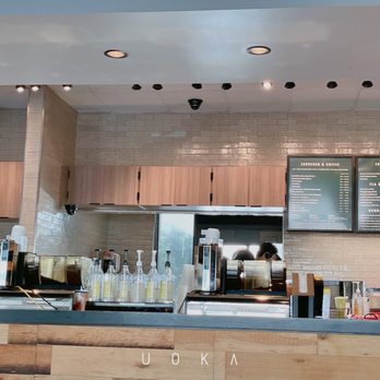 Starbucks - a coffee shop counter with a menu on the wall - Coffee & Tea Near Me - Houston, Texas Starbucks - a coffee shop counter with a menu on the wall - Coffee & Tea Near Me - Houston, Texas