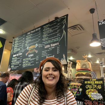 Grill 'Em All - My beautiful minion in front of the menu. - Burgers Near Me - Long Beach, California Grill 'Em All - My beautiful minion in front of the menu. - Burgers Near Me - Long Beach, California