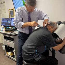 ProHealth & Wellness Chiropractic - Dr. Clare performing a chiropractic adjustment using the ProAdjuster 360.