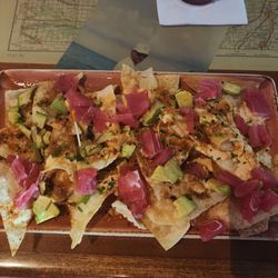 Ahi Poke Nachos. Great flavor. A little spicier than I expected. Won Tons for chips! Cooked well. Fresh Ahi tuna. Delicious!
