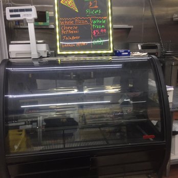 Super 8 - a pizza display in a restaurant - Gas Stations Near Me - Whittier, California