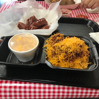 Smokey Mo's BBQ - Georgetown - As always a True Texan has Frito Pie, half sausage and Mac And Cheese. - Barbeque Near Me - Georgetown, Texas