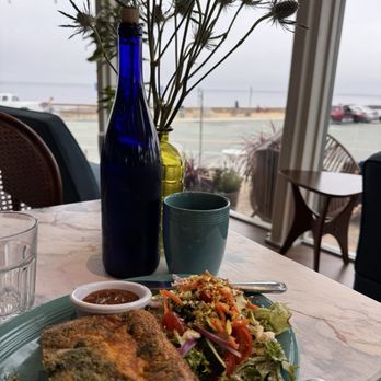 Crema - Veggie Fritata with side salad fresh greens and pistachio nuts!! Pacific Ocean in the background. - Breakfast & Brunch Near Me - Pacific Grove, California Crema - Veggie Fritata with side salad fresh greens and pistachio nuts!! Pacific Ocean in the background. - Breakfast & Brunch Near Me - Pacific Grove, California