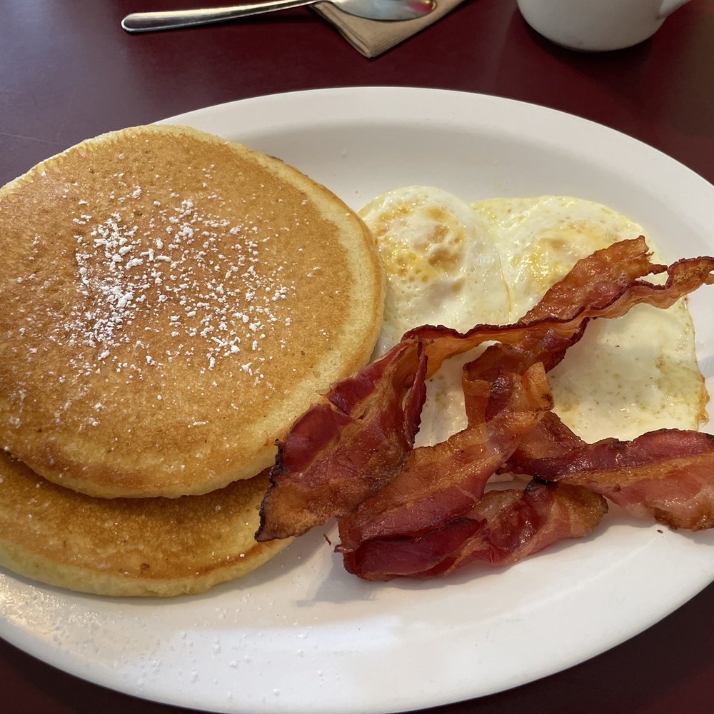 Victory Kitchen & Restaurant - 2 pancake, 2 eggs over medium, and bacon platter. - American Near Me - Lake Lure, North Carolina Victory Kitchen & Restaurant - 2 pancake, 2 eggs over medium, and bacon platter. - American Near Me - Lake Lure, North Carolina