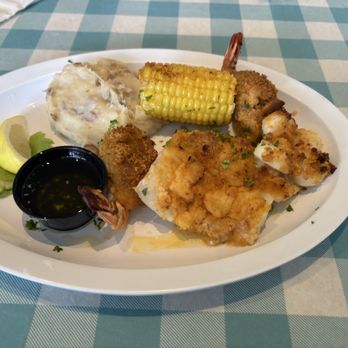 NE Seafood Shack - Grilled seafood plater with 2 stuffed shrimp, 4 medium scallops and a piece of haddock. Mashed garlic potatoes and corn on the cob. - Seafood Near Me - Leesburg, Florida NE Seafood Shack - Grilled seafood plater with 2 stuffed shrimp, 4 medium scallops and a piece of haddock. Mashed garlic potatoes and corn on the cob. - Seafood Near Me - Leesburg, Florida