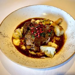 The Compound Restaurant - Braised lamb shank with risotto, cauliflower, and pomegranate seeds