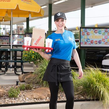 Sonic Drive-In - a woman holding a pizza box - Ice Cream & Frozen Yogurt Near Me - Quincy, Florida Sonic Drive-In - a woman holding a pizza box - Ice Cream & Frozen Yogurt Near Me - Quincy, Florida