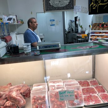 Alberta Halal Meat & Grocery - a man in a butcher's shop - Meat Shops Near Me - Calgary, Alberta Alberta Halal Meat & Grocery - a man in a butcher's shop - Meat Shops Near Me - Calgary, Alberta