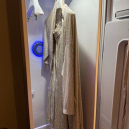 The robe is in a cool futuristic closet ( also where you put your clothes in after you change ) The robe is in a cool futuristic closet ( also where you put your clothes in after you change )
