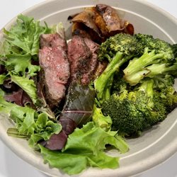 Quality Greens Kitchen - Herb Marinated Steak with mixed greens, roasted sweet potato, and sauteed broccoli - $17.95.