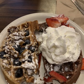 Funk 'n Waffles - Half banana bread waffles (topped with blueberries and walnuts) and half brownie batter waffle (topped with strawberries and whipped cream) - New American Near Me - Syracuse, New York Funk 'n Waffles - Half banana bread waffles (topped with blueberries and walnuts) and half brownie batter waffle (topped with strawberries and whipped cream) - New American Near Me - Syracuse, New York