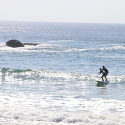 Poseidon Paddle and Surf School - Enjoy a tandem surf!