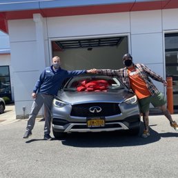 Respected sales rep Alex Kirby and I with my new 2019 Infiniti Qx30.