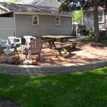 Sweeney's Custom Landscaping - a patio with a fire pit - Landscaping Near Me - Villa Park, Illinois