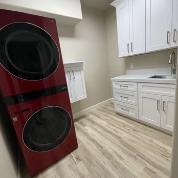 GT Tile & Stone - Laundry room after, new washer dryer tower, new cabinets, paint and additional flooring - General Contractors Near Me GT Tile & Stone - Laundry room after, new washer dryer tower, new cabinets, paint and additional flooring - General Contractors Near Me