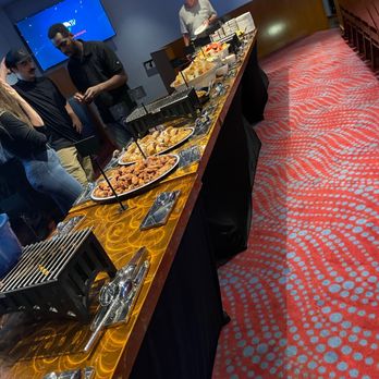 Big Al's - a group of people standing around a buffet - Sports Bars Near Me - Beaverton, Oregon