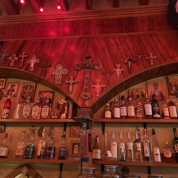 The Thin Man - a shelf of liquor bottles - Bars Near Me - Denver, Colorado