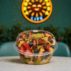 Dubai Chocolate Fruit Cup with Pineapples, Strawberries, Blueberries, and Bananas. Topped with Dubai Filling, Cream, Kanafa and Pistachios
