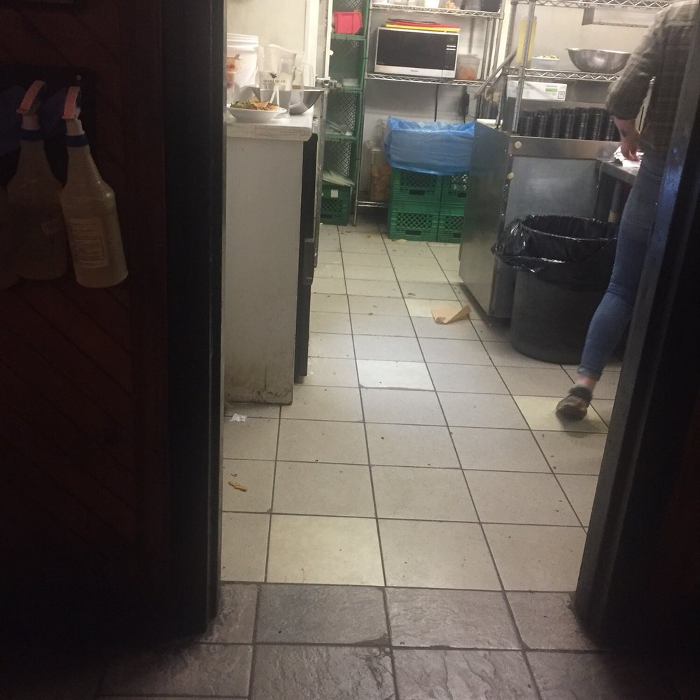 The Cellar - a woman standing in a kitchen - Pubs Near Me - Fredericton, New Brunswick