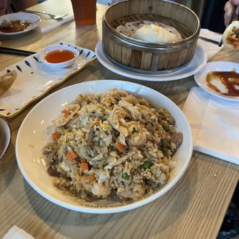 Dumpling Empire - Combination fried rice, one leftover crab Rangoon, a pork bun - Dim Sum Near Me - Omaha, Nebraska Dumpling Empire - Combination fried rice, one leftover crab Rangoon, a pork bun - Dim Sum Near Me - Omaha, Nebraska