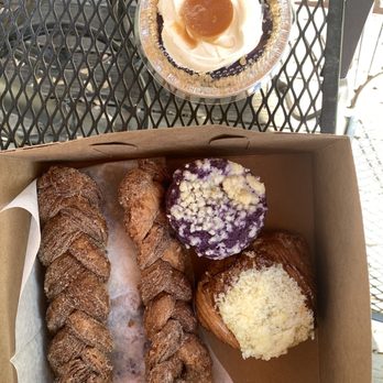 Crumbs and Flakes Bakery - Top - halo halo cream pie  Left - braided croissant churros  Middle right - ube coconut blueberry muffin Bottom right - Ensaymada - Bakeries Near Me - Alhambra, California