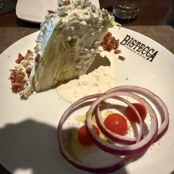 Bistecca - Bistecca Wedge Salad with tomato's placed on olive oil as a nice touch - Steakhouses Near Me - Washington, Pennsylvania