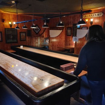 Fireside Bar - a woman standing at the bar - Pubs Near Me - Bend, Oregon