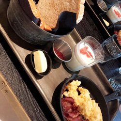 Black Steaks & Seafood - Classic breakfast- eggs, bacon, toast, croissant, and yogurt.