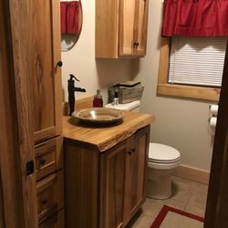 Dominion Door and Drawer - Hickory bathroom suite, with a live edge solid oak countertop and vessel sink