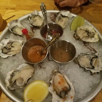 Herringbone Waikiki - I normally don't eat kimchi, but the waitress recommend that I put it on my oysters with a little tabasco, lemon, and salt. It was amazing! - Seafood Near Me - Honolulu, Hawaii